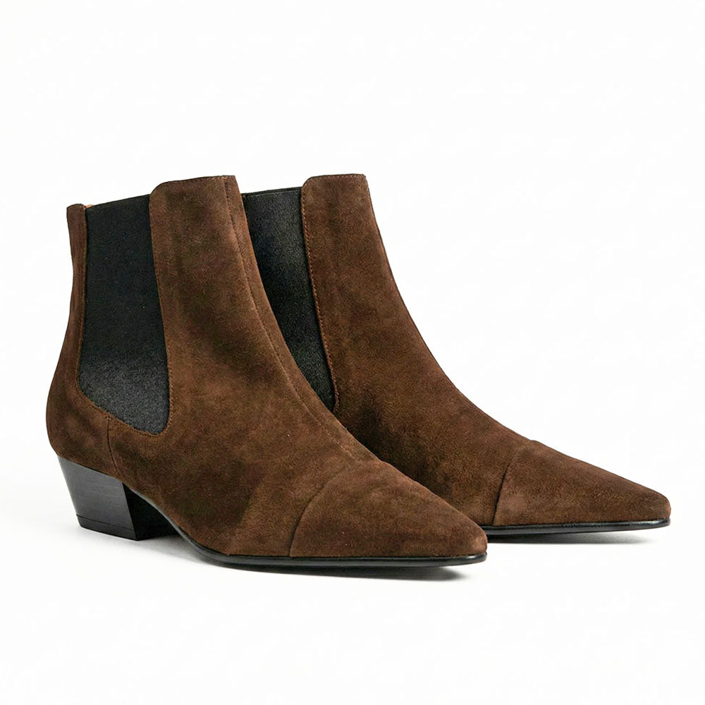 Pair of brown suede ankle boots on a white background