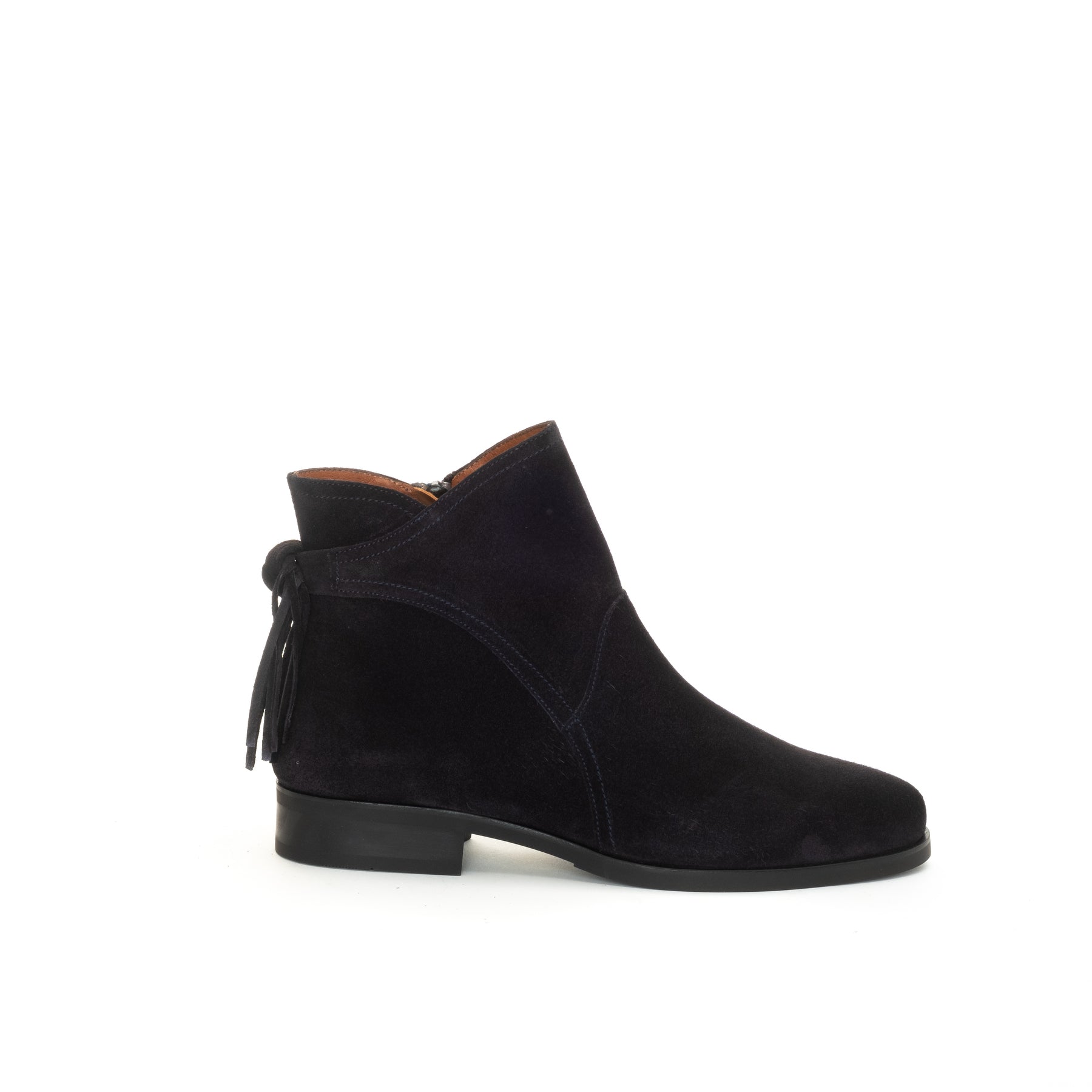 A single navy blue suede ankle boot with a low block heel and a hanging tassel detail on the side, shown from a profile view against a plain white background.