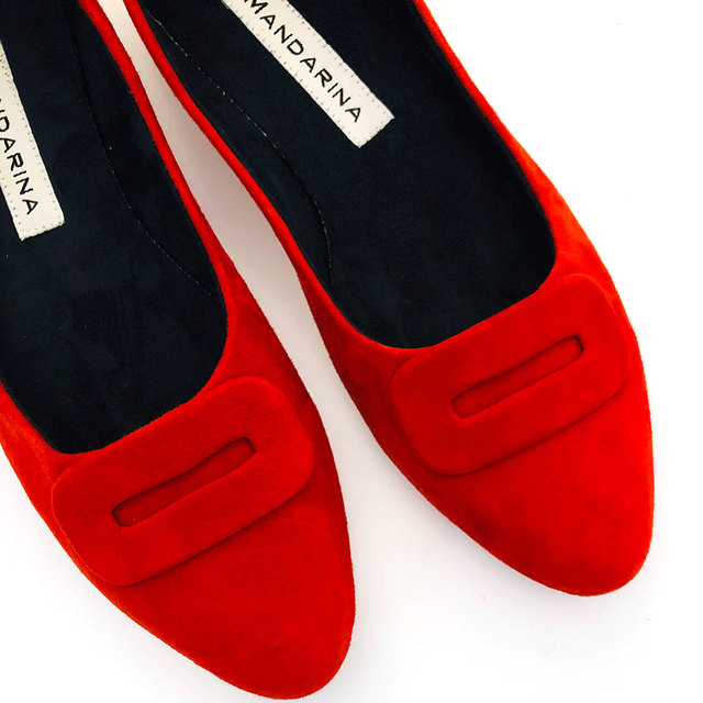 red suede flat pumps with buckle trim