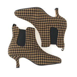 tan and black houndstooth ankle boots